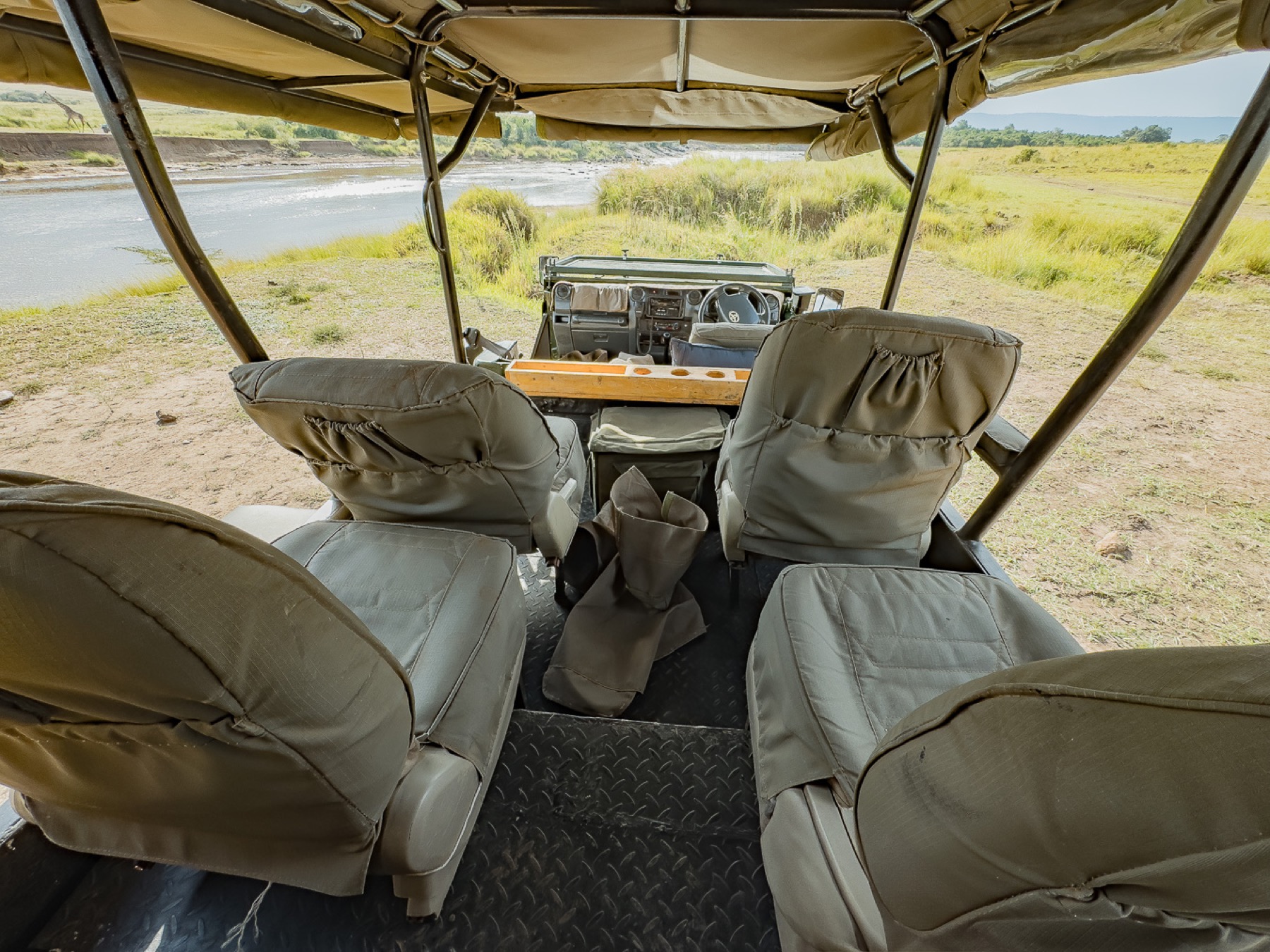 Inside a Mlima photographic safari vehicle, looking out over the Mara river